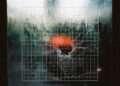 Abstract conceptualization of 2027 numerology, showing a heavy digital grid fracturing under a high voltage electrical surge to represent the Master Number 11 system override.